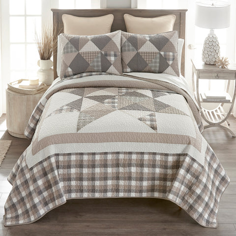 Shop the Donna Sharp Smoky Star Cotton Quilt Collection, featuring a rustic patchwork star design in taupe, gray, beige, and off-white. Available in twin, queen, king, and throw sizes. Perfect for farmhouse, country, or primitive décor.