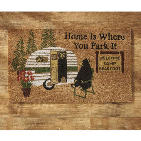 Our Home Is Where You Park Doormat will be a wonderful addition to your entryway. Cornered with black checkered pattern the message reads There's No Place Like Grandma's.