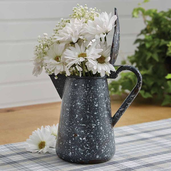 The Granite Enamelware Gray Pitcher with Lid can be used as a pitcher or as a decorative accessory. The multi colored granite in neutral tones will coordinate well with most colors.