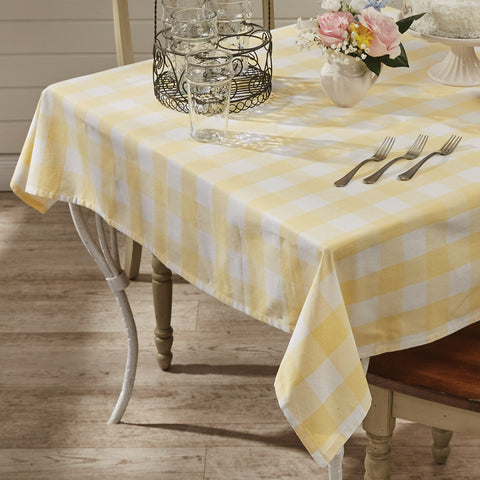 Add a fresh look to your country decor with the Wicklow Check Yellow Tablecloth! The colors of lemon yellow and candlelight white combine to create a bright and cheery check! This popular collection offers coordinating items as well (all sold separately), to complete your look!