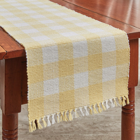 Add a fresh look to your country decor with the Wicklow Check Yellow Table Runners! The colors of lemon yellow and candlelight white combine to create a bright and cheery check! 