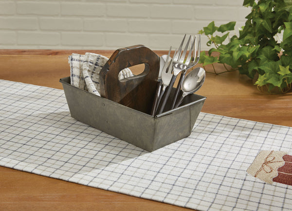 A small bread pan was repurposed into a kitchen caddy by adding a distressed wood handle. Country cute and oh so practical!