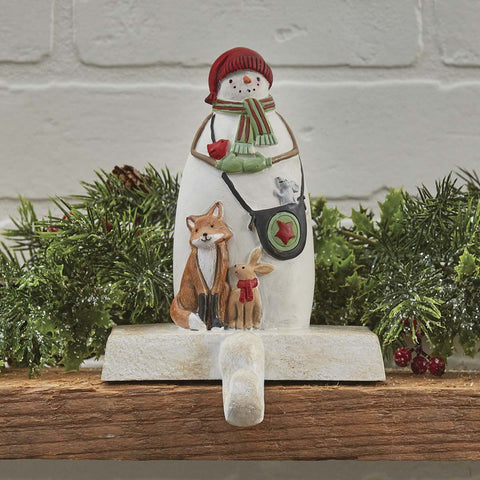 And the stockings were hung by the chimney with care...Sporting an classic snowman and furry friends, this beautiful Snowman Stocking Hanger will be happy to hold your favorite Christmas stocking! So versatile...use on a mantel, table, or any ledge in your home! 