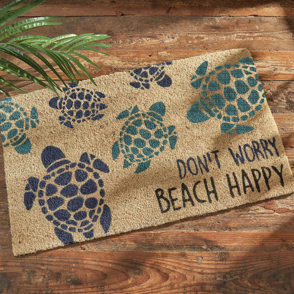 Our Don't Worry Beach Happy Doormat will be a wonderful addition to your entryway. It features multicolored sea turtles the words Don't Worry Beach Happy.