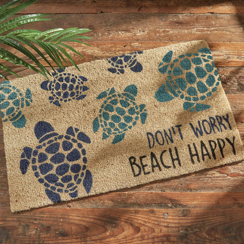 Our Don't Worry Beach Happy Doormat will be a wonderful addition to your entryway. It features multicolored sea turtles the words Don't Worry Beach Happy.
