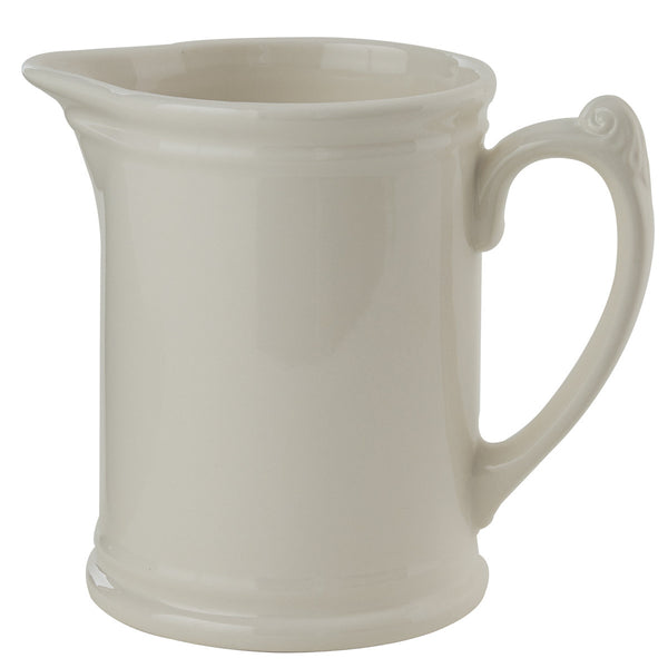 With the curves and detail of vintage style, this sturdy Tavern Pitcher in candlelight white will beautifully accent any country table. Pictured on left with Stoneware Milk Pitcher.