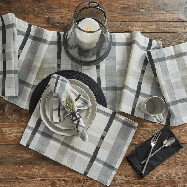Enhance your dining experience with these country charming Urban Plaid Printed Placemats! Soft tones of white, gray & tan blend together to create a pretty plaid that oozes warmth & style! Decorate your table in style!! Add to this classic look with the Urban Plaid napkins and table runner!