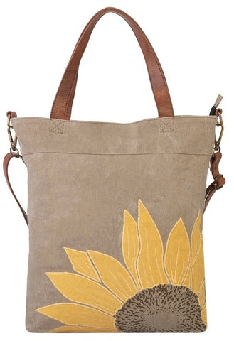 This do-it-all tote is sure to brighten up your outfit and your day with its truly sunny design. Made from durable re-milled and up-cycled military tarps & tents used by the army, covering trucks as tarps and providing shelter as tents, this textile is given new life.