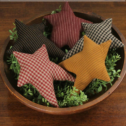 Add farmhouse charm with the Primitive Star Set of 5. Rustic fabric stars in ticking and check patterns, perfect for bowls, trays, and seasonal décor.