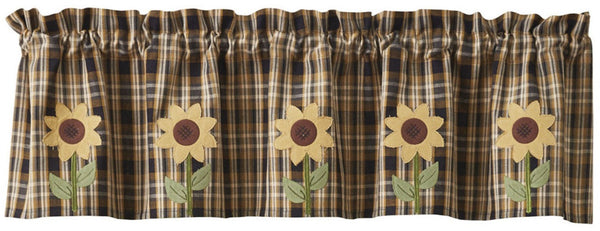 The beautiful rich colors of a sunflower in full bloom will adorn your windows with the Sunflower In Bloom Applique Valance. You can't go wrong with this plaid color combination of black, buttercream and antique white and the standout extra feature of the applique sunflowers. Beautiful!