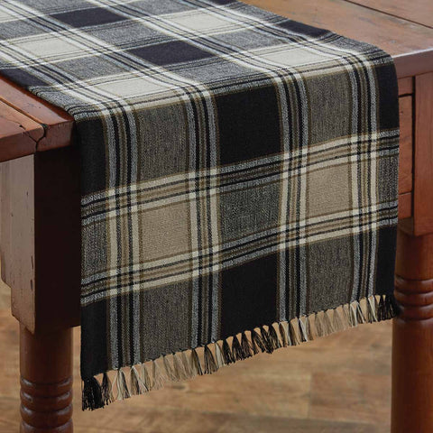 The deep black and sand brown large plaid fabric of the Soapstone Table Runner in colors of black, sandy brown and cream will give your table that country farmhouse appea