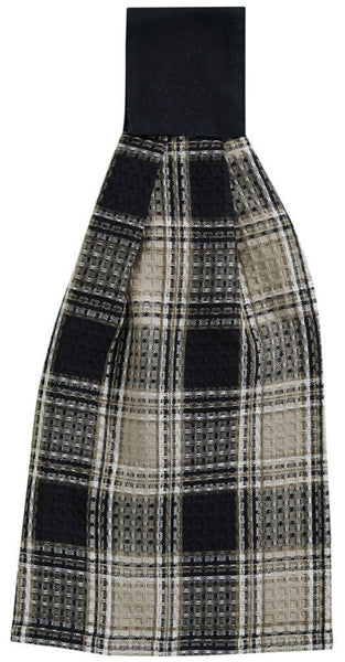 The deep black and sand brown large plaid fabric of the Soapstone Hand Tab Towel in colors for Black, Sandy Brown and Cream, will add to your country farmhouse look!