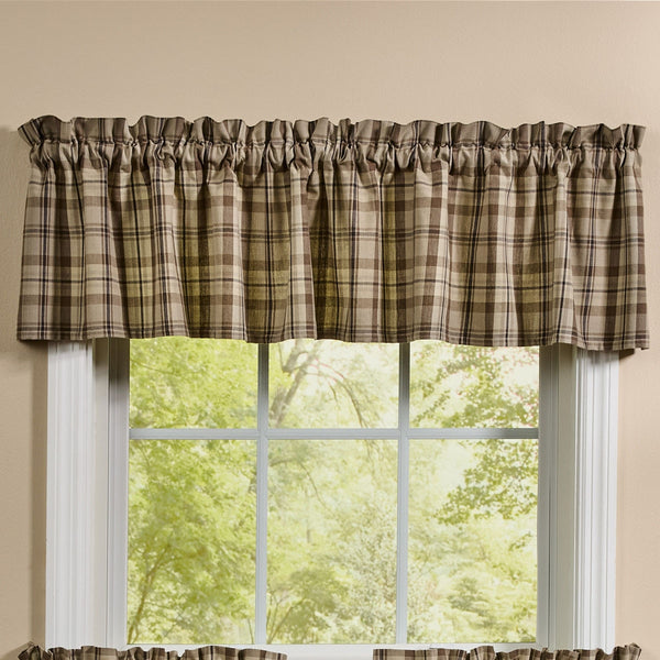 Plains Plaid valance with neutral tan and brown plaid fabric hanging over a farmhouse window