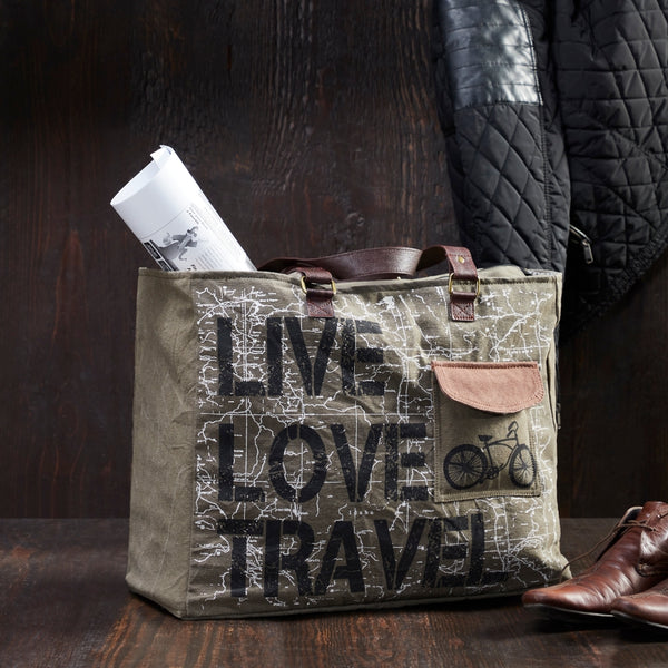 Command the attention of fellow travelistas and sight-see in style with the Live Love Travel weekender, perfectly equipped for all your adventures. Made from durable re-milled and up-cycled military tarps & tents used by the army, covering trucks as tarps and providing shelter as tents, this textile is given new life.