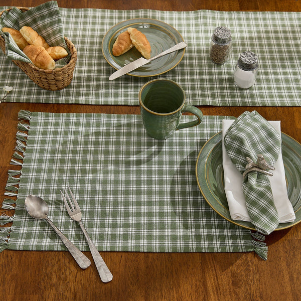 Set of four Stafford Ivy green and ivory plaid farmhouse placemats with decorative fringe ends.