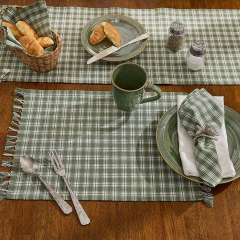 Set of four Stafford Ivy green and ivory plaid farmhouse placemats with decorative fringe ends.