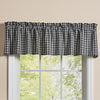 Primitive black and cream plaid Stafford farmhouse window valance displayed over a country style window.
