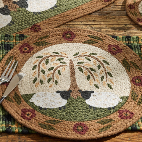 Set of 4 round braided placemats with primitive willow tree and sheep design in warm country colors