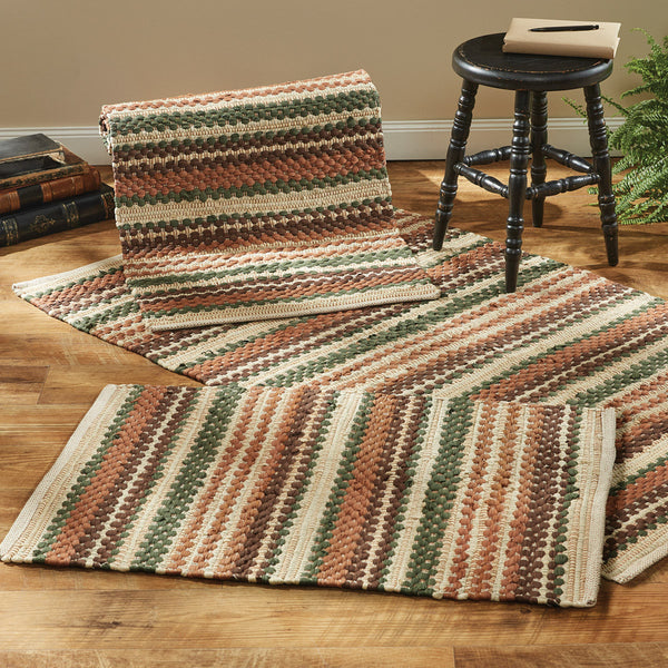 Add texture and a touch of color to your home with the Woodbourne Chindi Rugs. The colors of orange, green, brown, and tan combine to create a stylish charm.