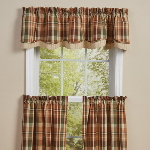 Bring the outdoors inside with this Woodbourne Lined Layered Valance.  Features stunning shades of orange, green, brown, and tan that combine to create a pretty plaid! The striped bottom layer is the perfect finishing touch!