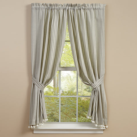 The<span>&nbsp;</span><strong>Ticking With Ball Fringe Panels</strong><span> </span><span>&nbsp;</span>will add that classic country look to your home with its charming dove gray and candlelight white striped design! The ball fringe is the perfect finishing touch!