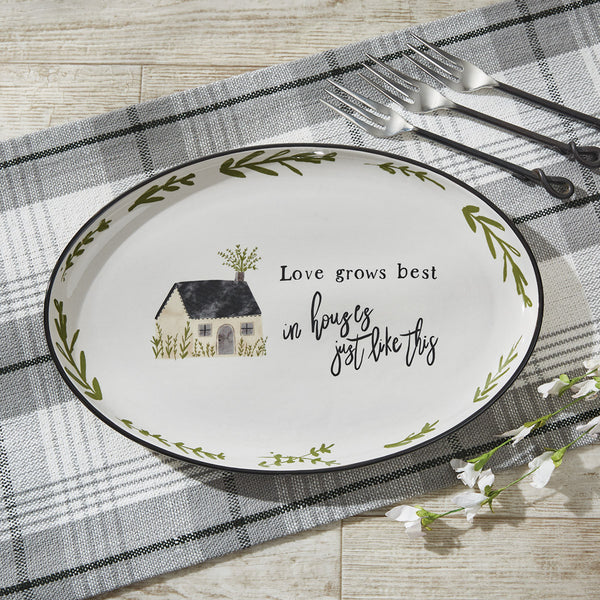 Add a gorgeous touch to your country kitchen with the Together Oval Platter by Park Designs! Made of stoneware and featuring a serene picture of a country home, a charming saying, and a border of rutsic green leaves, this platter is sure to add charm to your country decor! Complete the look with the Together dinner plates, salad plates cereal bowls, mugs, spoon rest, and salt and pepper set!