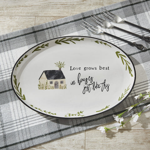 Add a gorgeous touch to your country kitchen with the Together Oval Platter by Park Designs! Made of stoneware and featuring a serene picture of a country home, a charming saying, and a border of rutsic green leaves, this platter is sure to add charm to your country decor! Complete the look with the Together dinner plates, salad plates cereal bowls, mugs, spoon rest, and salt and pepper set!