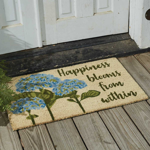 Our Happiness Blooms Doormat will liven up your entryway and add warm welcome to your home.  Features three blue flower blossoms with the words Happiness Blooms From Within.