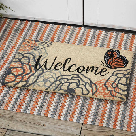Our Apricot & Stone Doormat will liven up your entryway and add warm welcome to your home.  Features multicolored flowers and a monarch butterfly with the word Welcome.