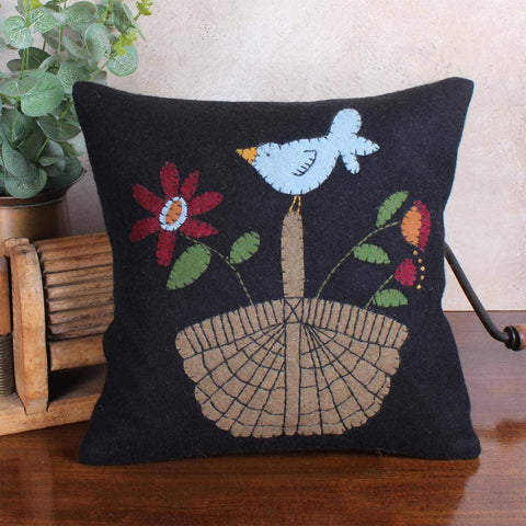 Add rustic charm with the Basket of Plenty Pillow. This 14x14 wool felt pillow features a folk-art basket and floral design, perfect for primitive, farmhouse, or country décor.