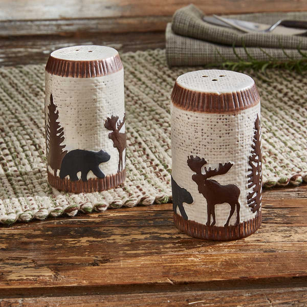 Spice up your kitchen with the Wilderness Trail Salt & Pepper Set for a charming touch of the wilderness and a rustic feel! Complete the look with the coordinating kitchen linens and tableware!