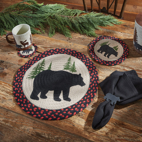 The Black Bear Braided Placemat measures 15" in diameter and is perfect for adding the great outdoors to your table. Featuring a black bear and pine trees surrounded by a red and black boarded, these placemats will blend easily with your cabin, country or rustic kitchen decor. 