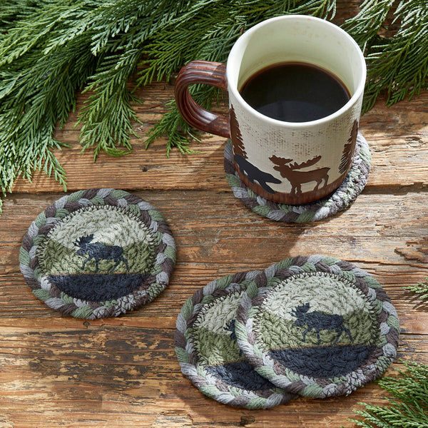 The Moose Braided Coasters are perfect for your rustic kitchen decor.  While offering soft texture, these circle coasters will add a sense of the great outdoors to your table with green and grey tones and the moose silhouette. Coordinate with our other Moose braided Trivets, Placemats, and Rugs for the complete look!