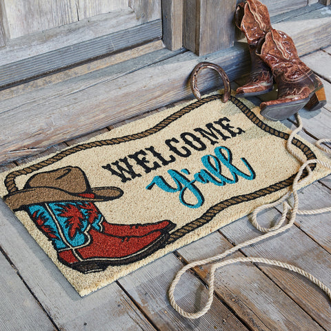 Our Welcome Y'all Doormat will liven up your entryway and add warm welcome to your home.  Features a pair of cowboy boots and cowboy hat with a rope boarder and the words Welcome Y'all.