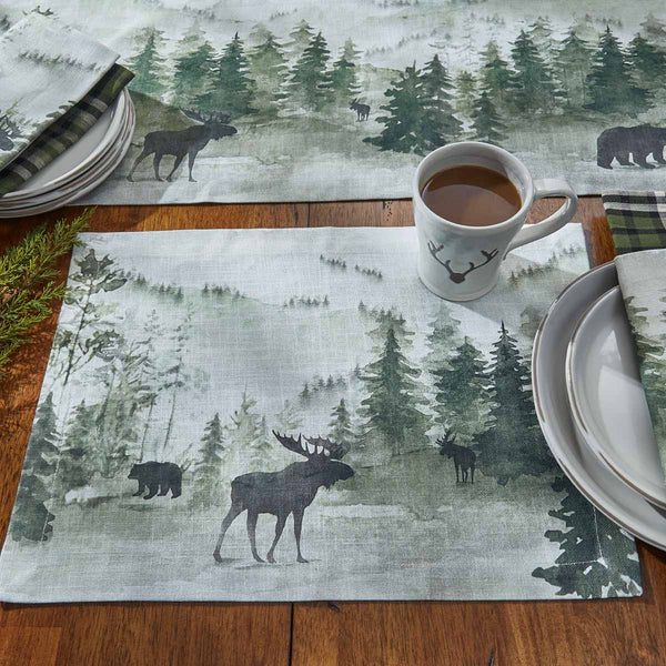 This  Watercolor Wildlife Placemat offers a beautiful outdoorsy appeal! Featuring a muted blend of grays and greens that work together to create a scene of animals in their natural habitats, these placemats are sure to bring the rugged outdoors in! Pair with the coordinating pillow, doormat, valance, napkins, and dishtowels for a complete look!