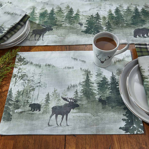 This  Watercolor Wildlife Placemat offers a beautiful outdoorsy appeal! Featuring a muted blend of grays and greens that work together to create a scene of animals in their natural habitats, these placemats are sure to bring the rugged outdoors in! Pair with the coordinating pillow, doormat, valance, napkins, and dishtowels for a complete look!