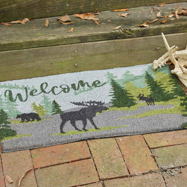 This Watercolor Wildlife Doormat offers a beautiful outdoorsy appeal! Featuring a muted blend of grays and greens that work together to create a scene of animals in their natural habitats, this doormat is sure to bring the rugged outdoors to your doorstep! Pair with the coordinating table runner, doormat, valance, napkins, and dishtowels for a complete look!  Made from natural fibers, hand printed with colorfast non-toxic dyes. Durable, mildew and skid resistant.