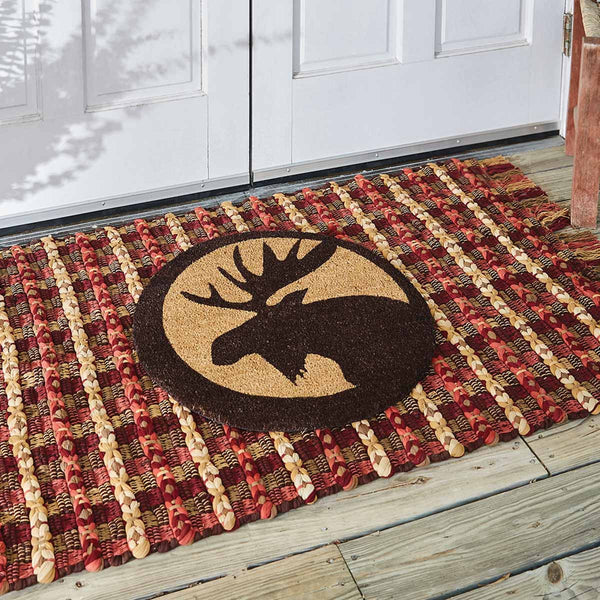 Our Kennebec Moose Doormat will be a wonderful addition to your entryway. Featuring a black moose head silhouette on a circle shape rug. Made from all-natural fibers and hand painted sentiment in colorfast dyes, this doormat is durable and skid resistant. It will be the perfect addition to your decor that can be used year after year.