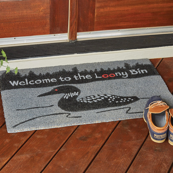 Our Welcome to the Looney Bin Doormat will liven up your entryway to any home.  Features a duck on the water and trees with the words Welcome To The Looney Bin.