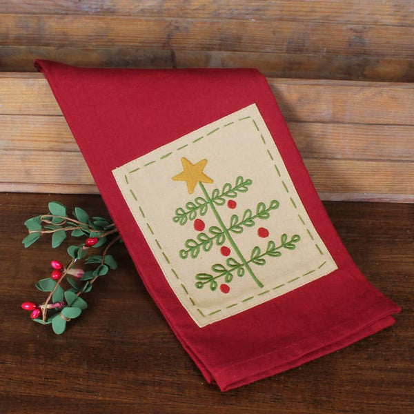 O Christmas Tree towel featuring an embroidered primitive Christmas tree with berries and star on a barn red cotton towel.