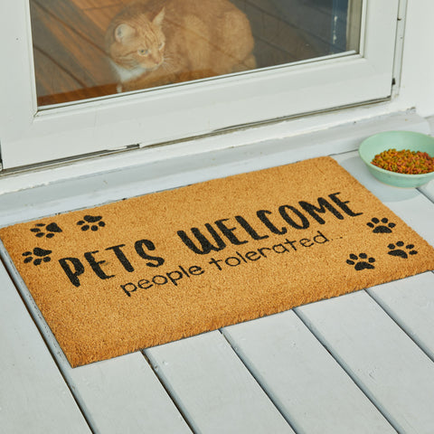 Our Pets Welcome People Tolerated Doormat will liven up your entryway and express your love for pets.  Featuring paw prints with the words Pets Welcome People Tolerated.