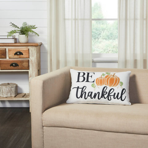 Add a pop of fun fall style with this rectangular accent pillow. The Annie Black Check Be Thankful Pumpkin Pillow measures 14 by 22 inches. The filled pillow features word art reading, Be Thankful with a fun pumpkin detail in burnt orange surrounded by small leaves. 