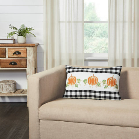 Add a burst of classic fall style with this rectangular accent pillow. The Annie Black Check Pumpkin Patch Pillow measures 14 by 22 inches. The filled pillow features a row of three orange pumpkins surrounded by winding leaf accents