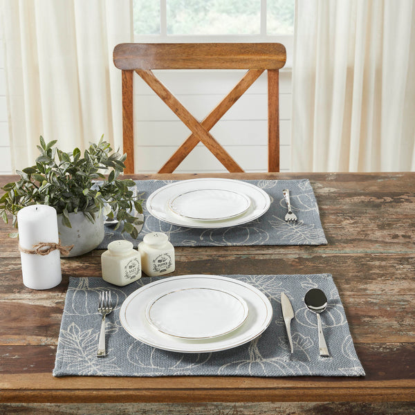 Create the perfect table settings with a modern country feel accented with a classic fall print. The Silhouette Pumpkin Placemat Set includes two placemats measuring 13x19 inches each. The table place settings are constructed with a durable recycled plastic fabric in deep grey. A pattern of pumpkins, leaves and acorns in warm cream adds a soft dose of seasonal charm. Machine wash and tumble dry low.