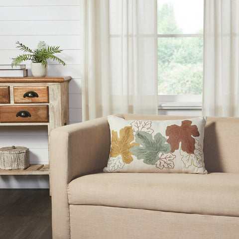 Add a vintage pop of style to your fall living room or entryway decor with a retro design and warm grain sack stripes. The Bountifall Embroidered Leaves Pillow measures 14x22 inches and is constructed with a water-resistant recycled plastic fabric. The reverse features a vintage grain sack stripe in cream and gold while the front is adorned with a mix of fall leaves in shades on gold, green and rust.