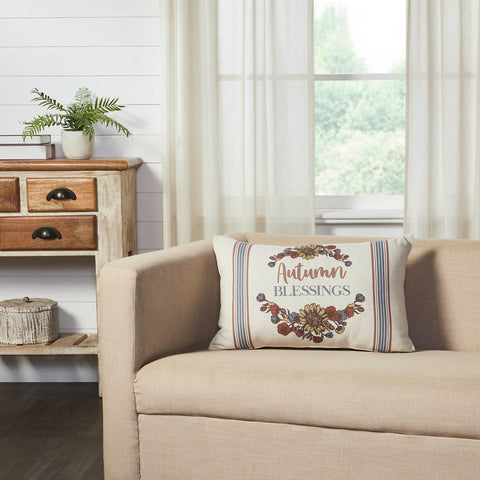 The Bountifall Autumn Blessings Pillow measures 14x22 inches and is constructed with a water-resistant recycled plastic fabric. The reverse features a vintage grain sack stripe in cream and gold while the front is adorned with a vintage-inspired floral that brackets the phrase, Autumn Blessing. Bold vertical stripes surround the design in soft blue and orange for a retro feel. 