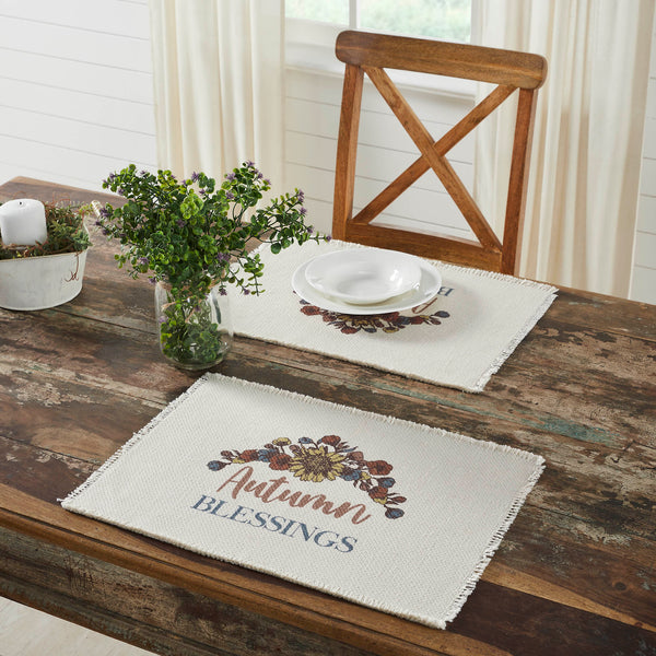 The Bountifall Autumn Blessings Placemat set includes two matching placemats measuring 13x19 inches each. The fall place settings feature fringed fabric in a soft cream crafted with water-resistant recycled plastic. Each mat is decorated with a vintage-inspired floral design that highlights word art reading, Autumn Blessings.
