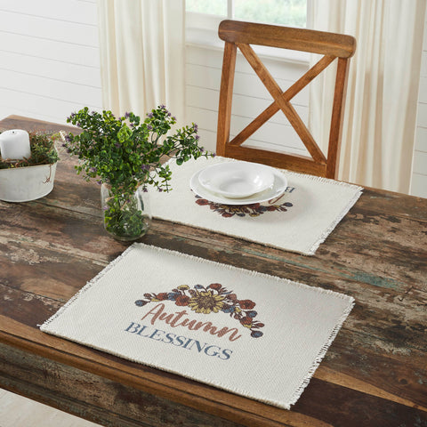 The Bountifall Autumn Blessings Placemat set includes two matching placemats measuring 13x19 inches each. The fall place settings feature fringed fabric in a soft cream crafted with water-resistant recycled plastic. Each mat is decorated with a vintage-inspired floral design that highlights word art reading, Autumn Blessings.
