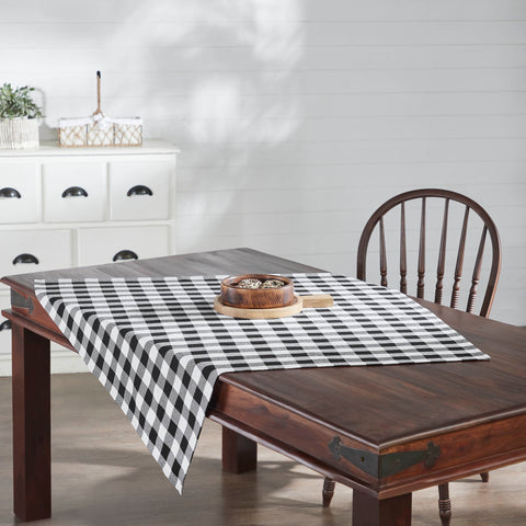 Add rustic charm with the Annie Buffalo Check Black 40x40 Table Topper. Classic buffalo plaid cotton square topper, perfect for farmhouse or country dining décor.