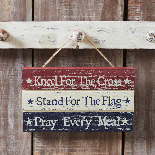 Enhance your Independence Day Decor with the VHC Brands Kneel Stand Pray Wooden Sign, a distinctive piece measuring 5.25x9x0.75 inches. Crafted from tropical wood with a Burgundy finish, this rectangle-shaped sign seamlessly integrates into your Americana-themed spaces. Its distressed appearance adds a rustic touch, making it a versatile choice for decorating various areas, including the bathroom, bedroom, dining room, entry, kitchen, or living room. 